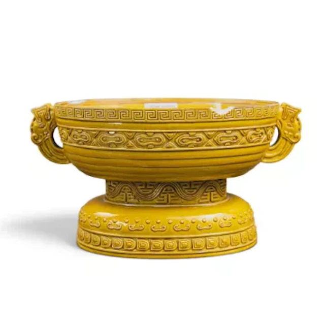 A Chinese 19th century Archaic handled footed vessel in the manner