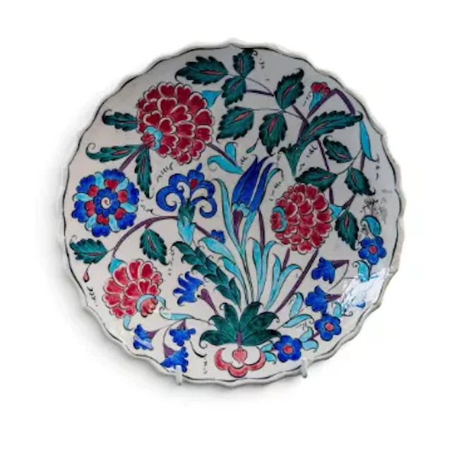 An Isnik ceramic dish, decorated in a typical floral Islamic design