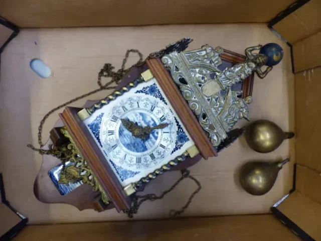 A German made mechanical wall clock in the Dutch style, with blue