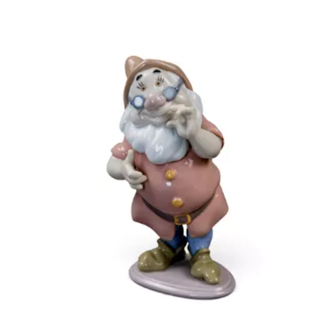 A Lladro Disney figure, 'Doc' from Snow White and the Seven Dwarfs