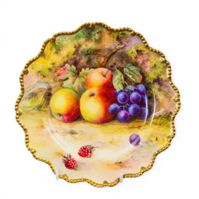 A Royal Worcester rope edged plate, with scalloped rim, with hand