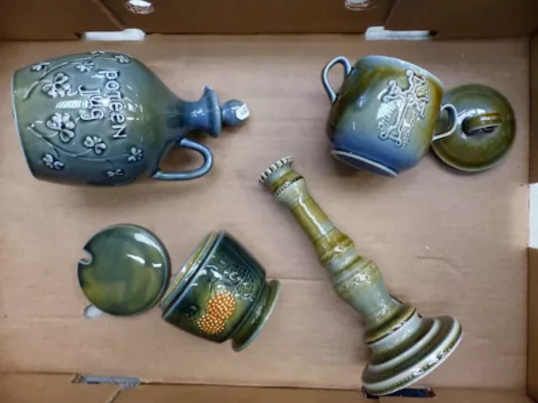 Irish Wade items to include a candlestick holder, lidded pots and