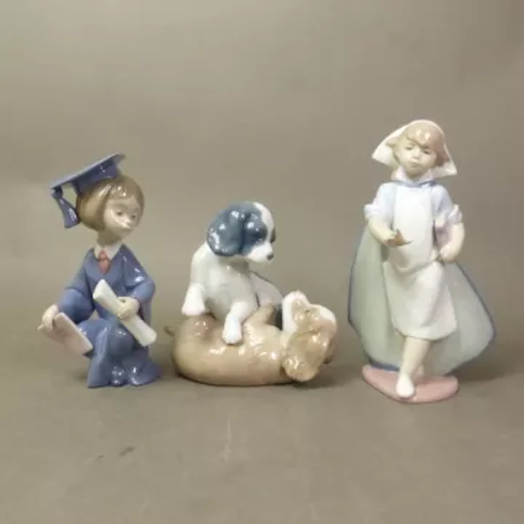 Two Lladro figures, a Nurse and a Student, together with a Nao figural