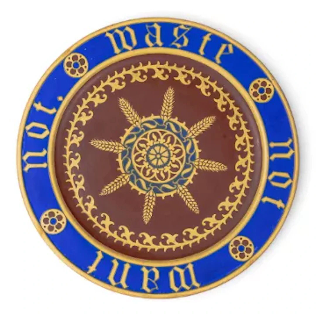 A Minton bread plate, designed by A W N Pugin, c1850, with motto to