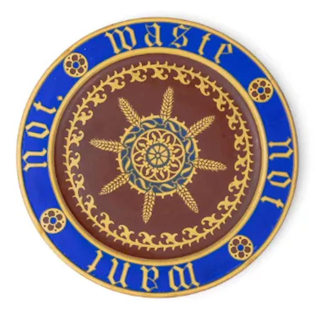 A Minton bread plate, designed by A W N Pugin, c1850, with motto to