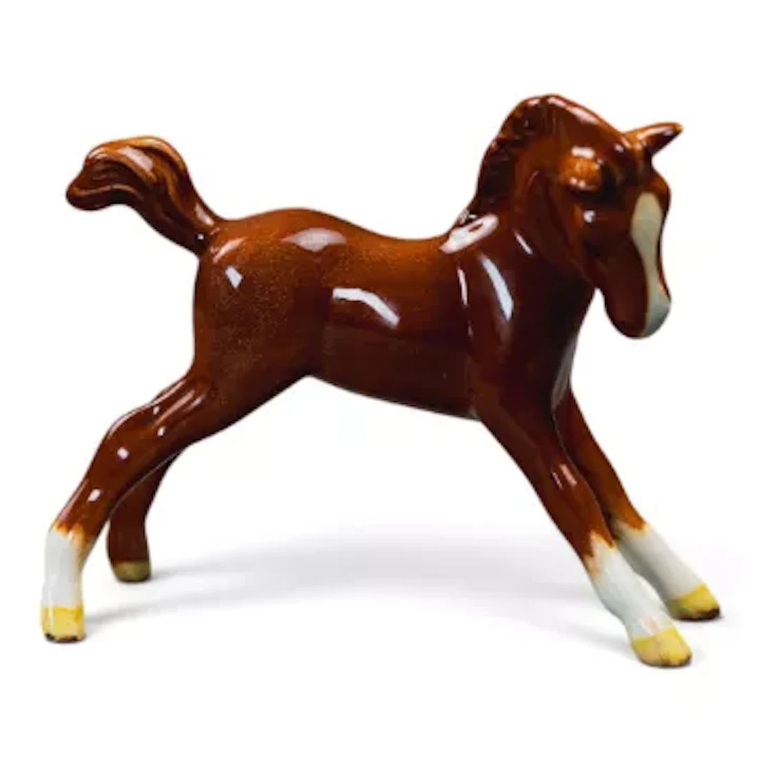 Beswick small Stretched Foal facing right in Chestnut gloss. Model 815. h.8cm