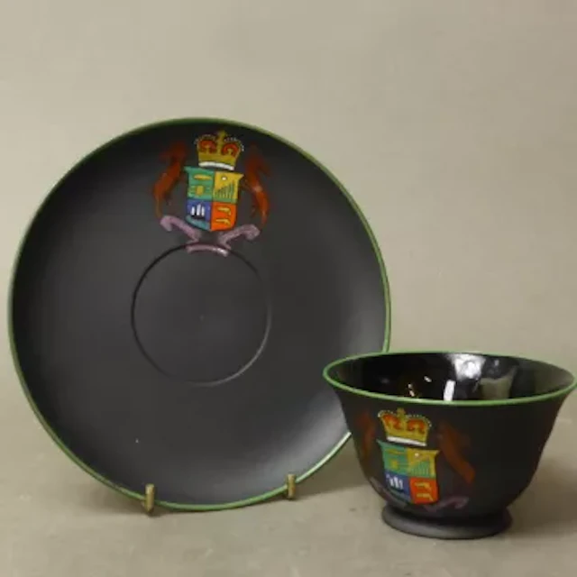 Wedgwood Kenlock Ware black basalt tea cup and saucer set, polychrome