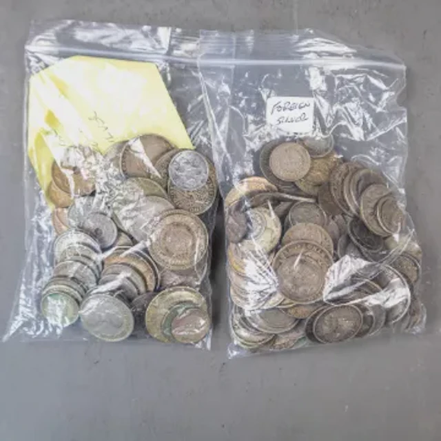 A bag of mainly (but not all) silver coinage of a wild assortment