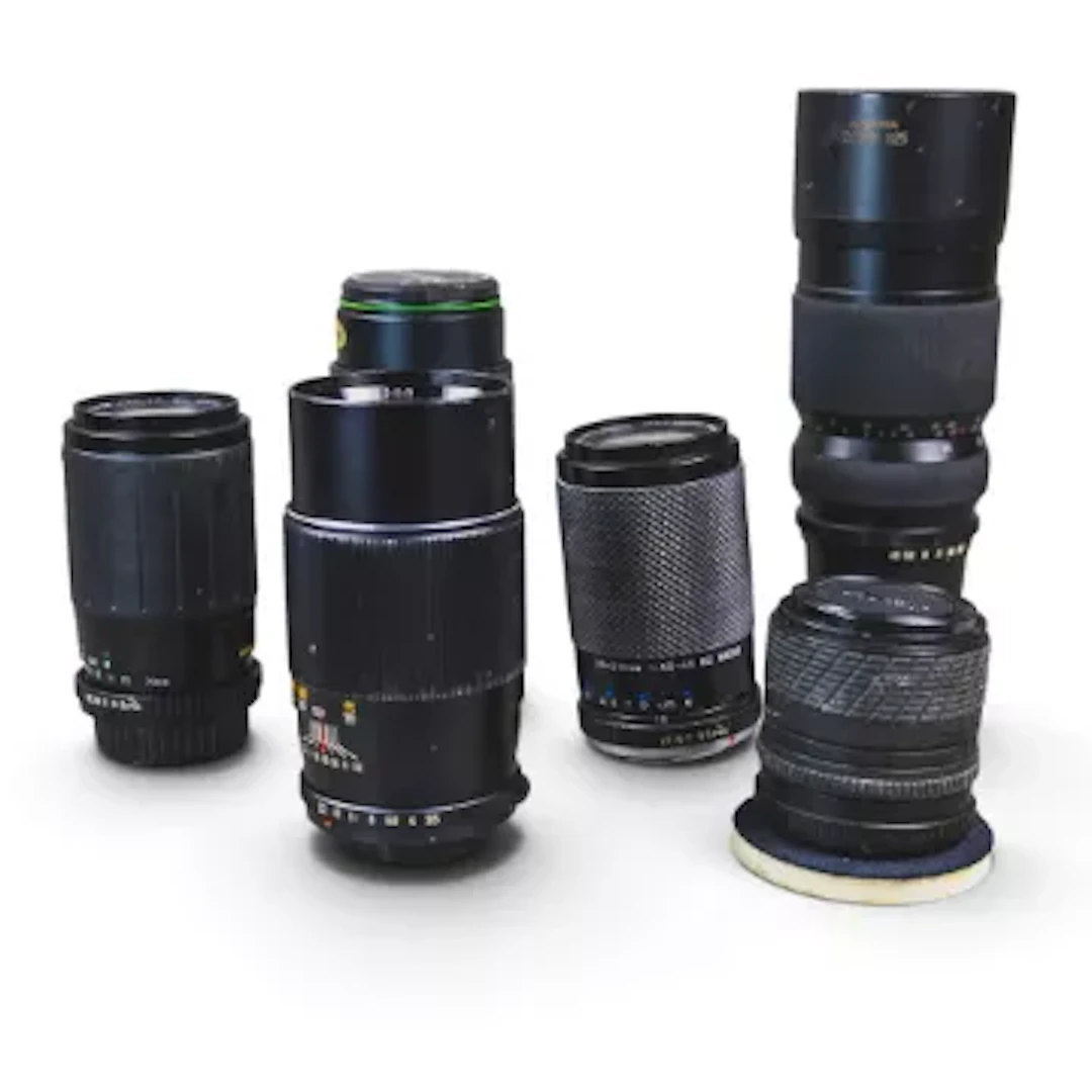 A collection of telephoto lenses to include Komura Zoom 925 90-250mm