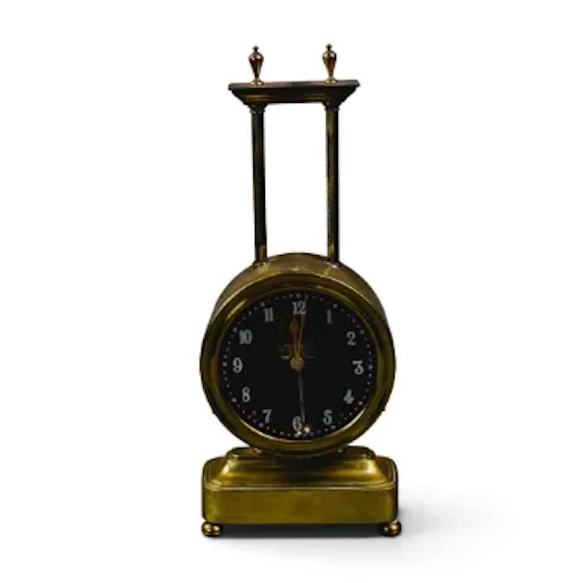 An early 20th century keyless Gravity clock, circular dial and casing