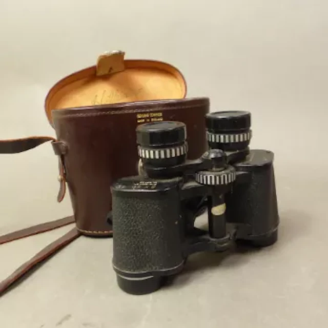 Leather cased pair of Hilkinson 8 x 30 binoculars.