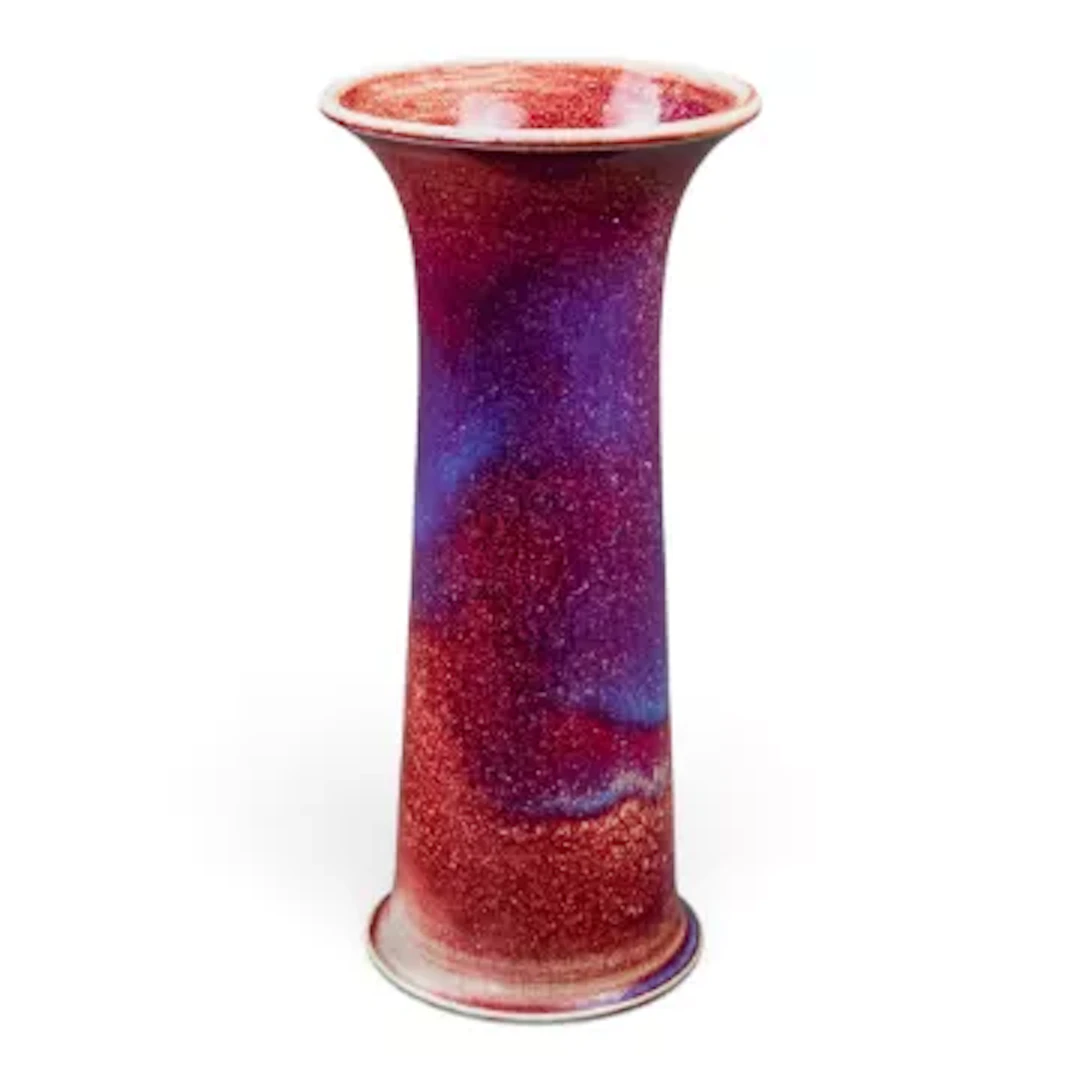 A Ruskin Lily vase, Sang de Boeuf glaze with blue clouding, h.24.5cm.