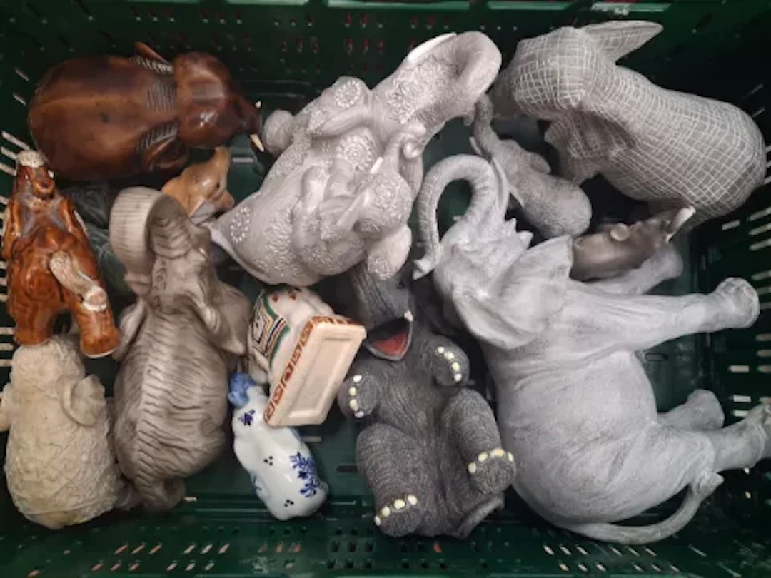 A collection of resin, wood and ceramic elephant figures (1 tray).