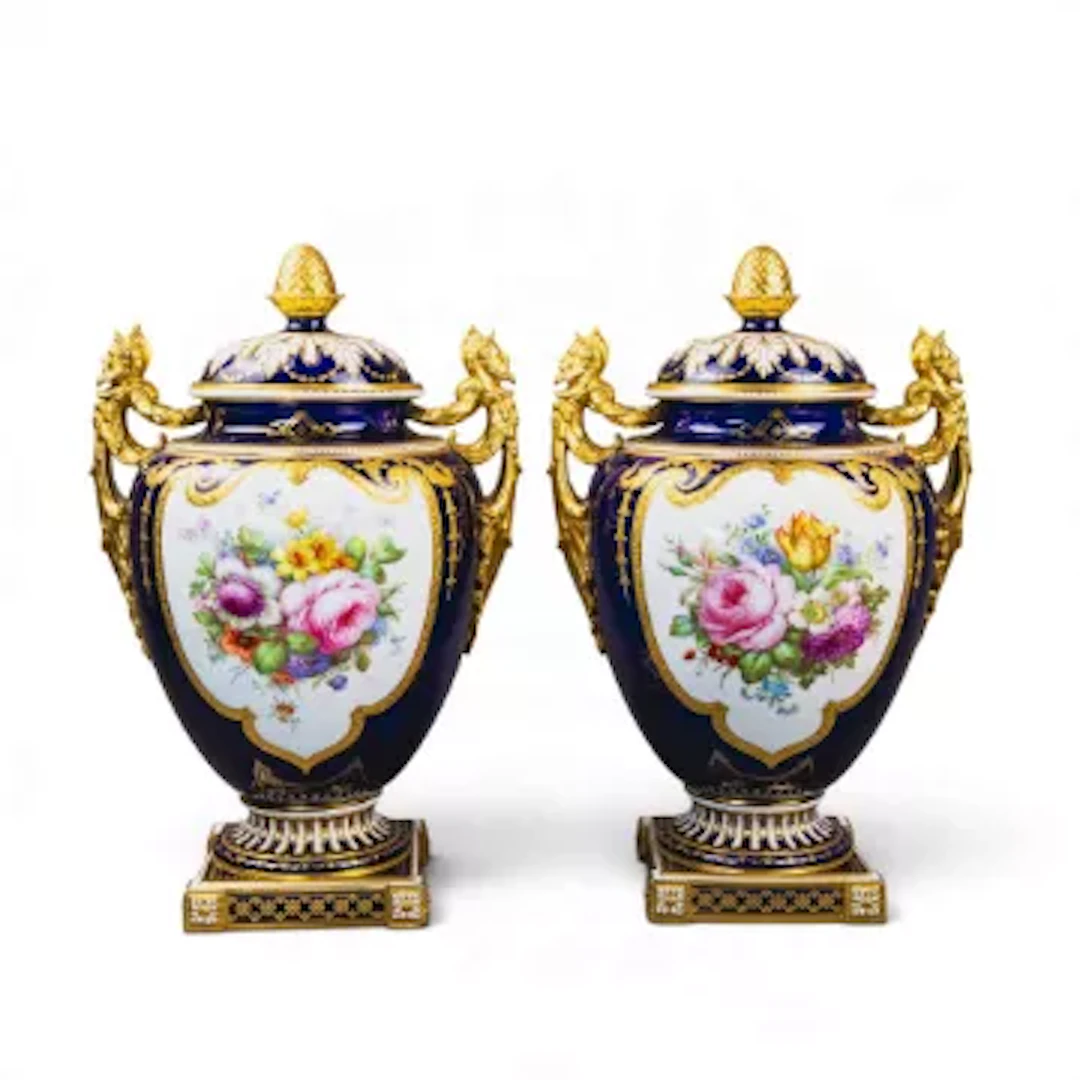 A pair of Royal Crown Derby 2 handled covered urn shaped vases on