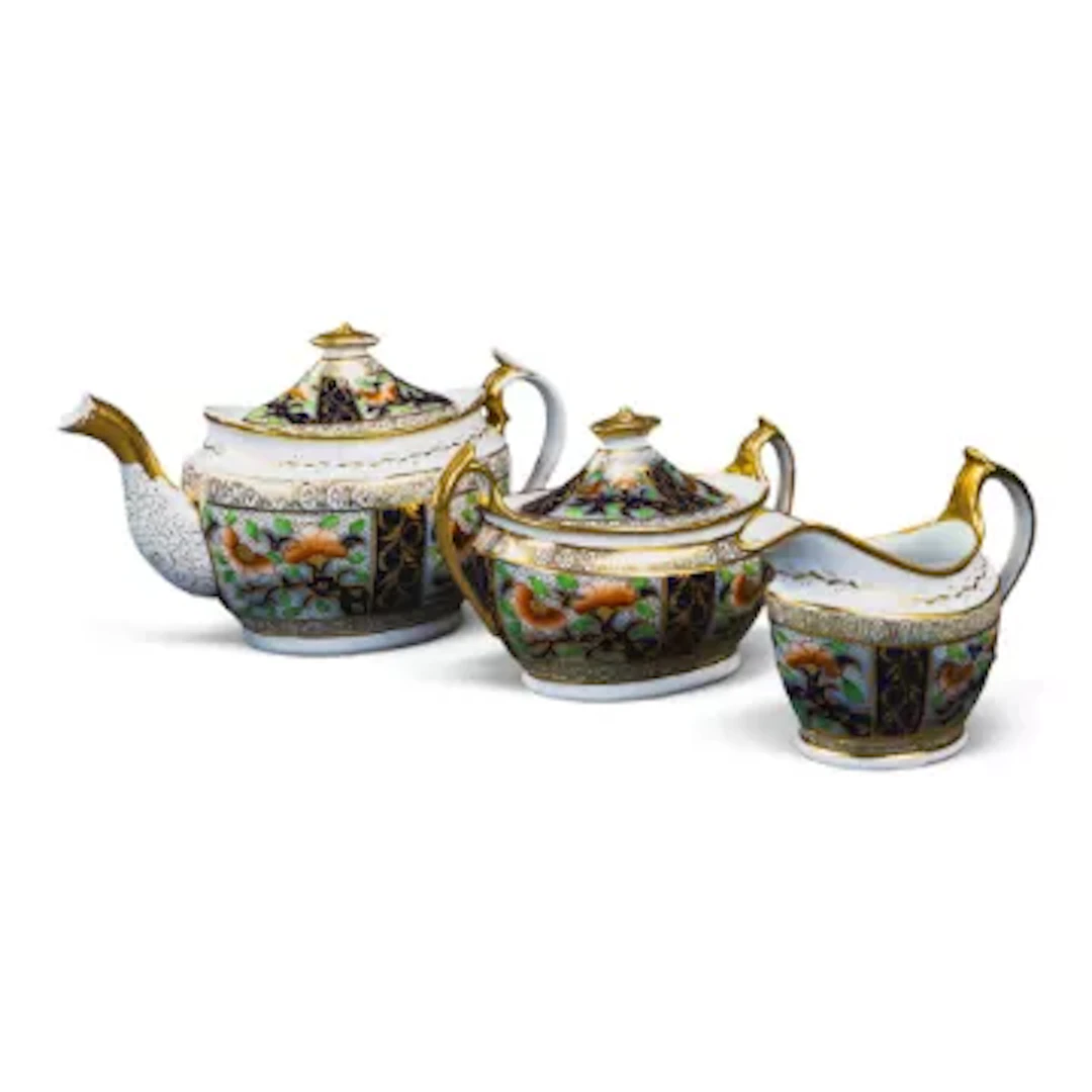 An English porcelain 19th century teapot, sucrier & milk jug, decorated