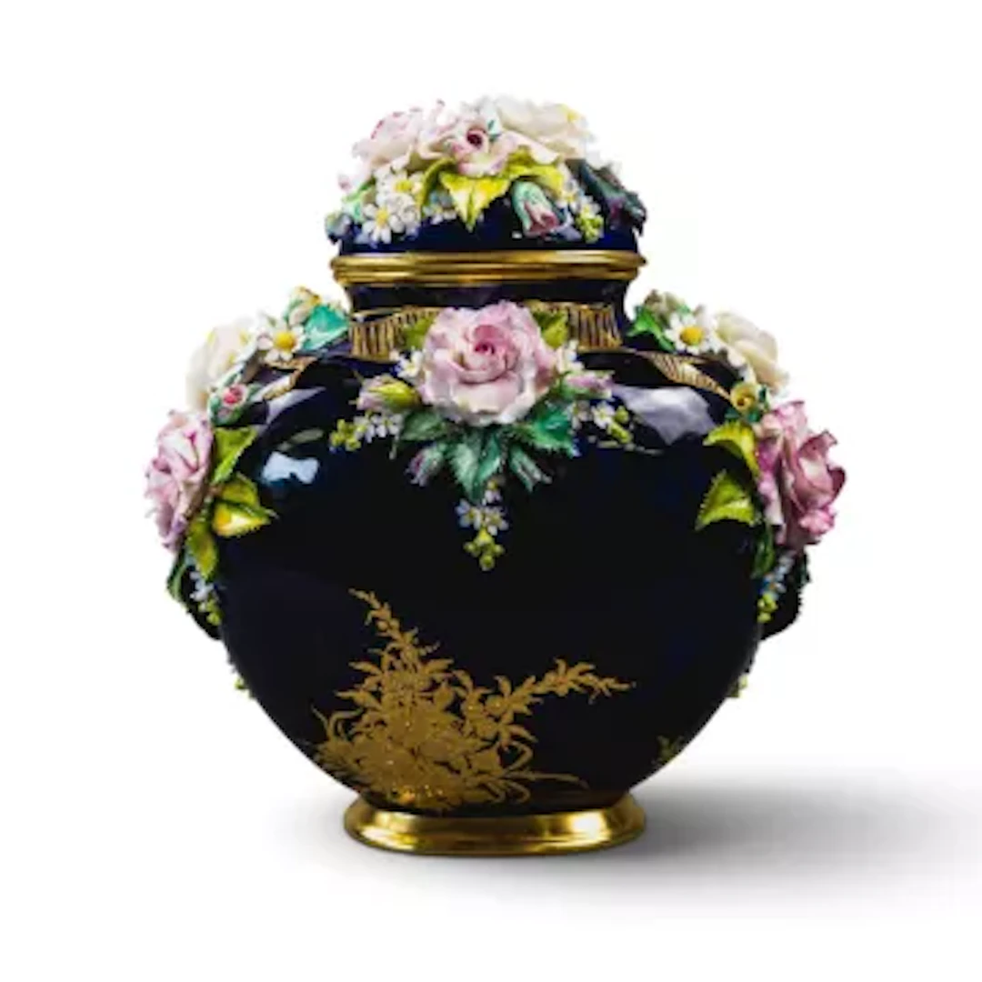 A Lynton porcelain lidded casket type vase, decorated with embossed