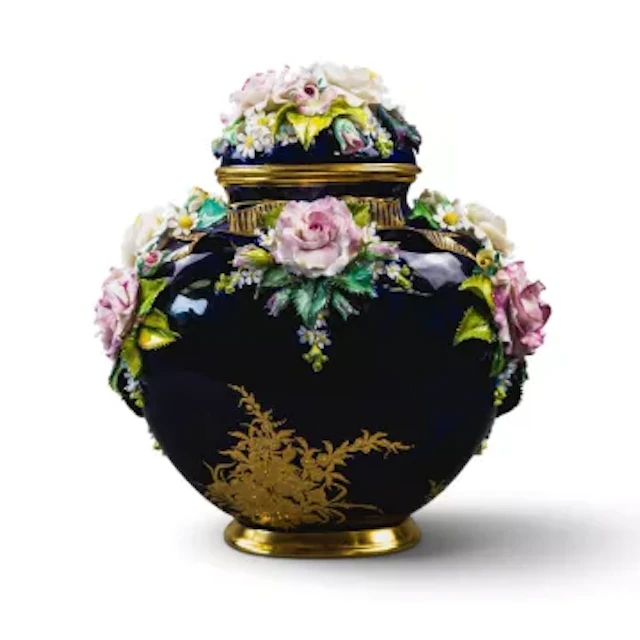 A Lynton porcelain lidded casket type vase, decorated with embossed
