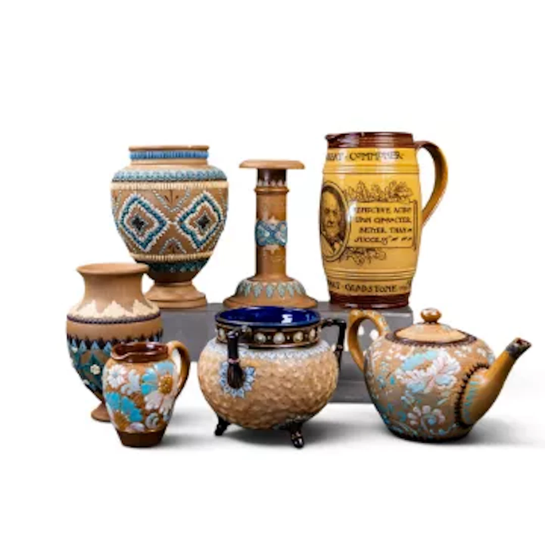 A group of Doulton Lambeth Ware pieces to include a 3 footed Tyg in