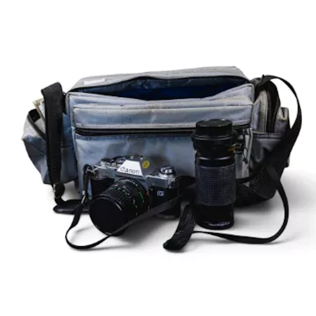 A Canon AL-1 35mm SLRT film camera with 35-70mm f/3.5-4.5 lens, Pressman