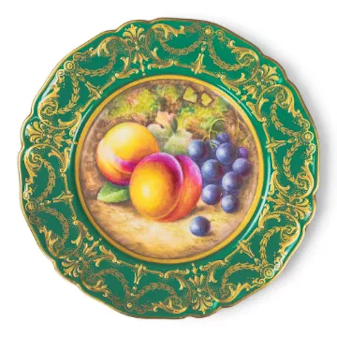 A Royal Worcester plate with fruit decoration to centre and a green