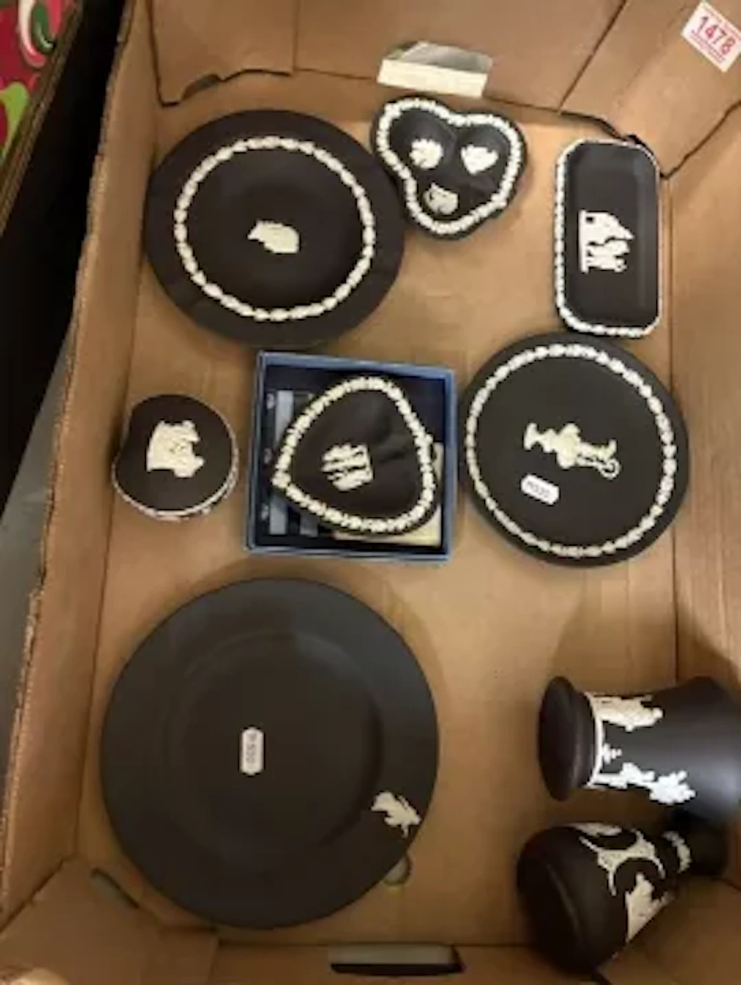 A good collection of white on black Wedgwood jasperware items, to