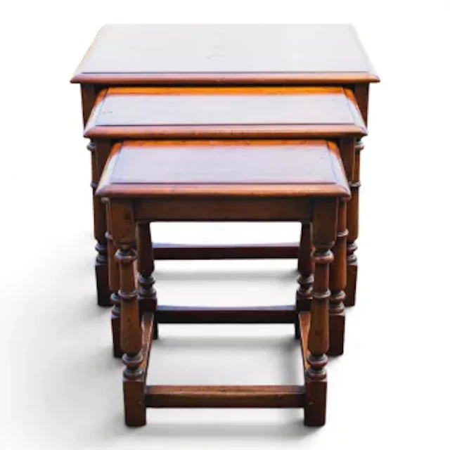 A good quality reproduction Ipswich oak nest of three tables, h.54cm