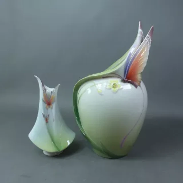 Two Franz ceramic vases with stylised butterfly detail, height of