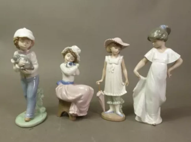 Four Nao figurines, Boy with Puppy, Girl with Puppy, Girl with Parasol