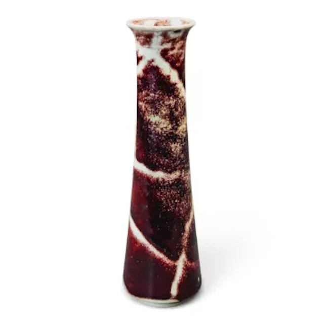 A Ruskin vase, Sang de Boeuf glaze with fissured effect, h.20cm.