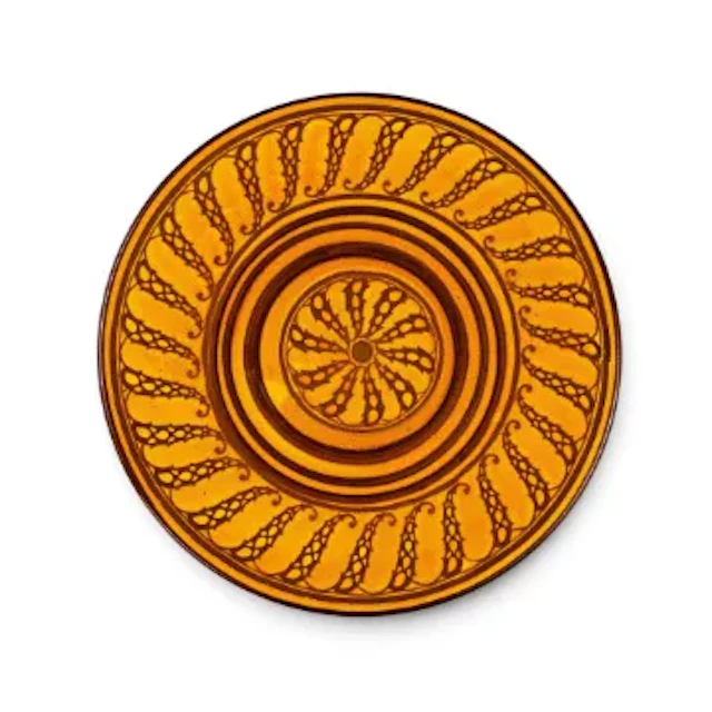 A Royal Doulton Charger, decorated in a scrolling design against a