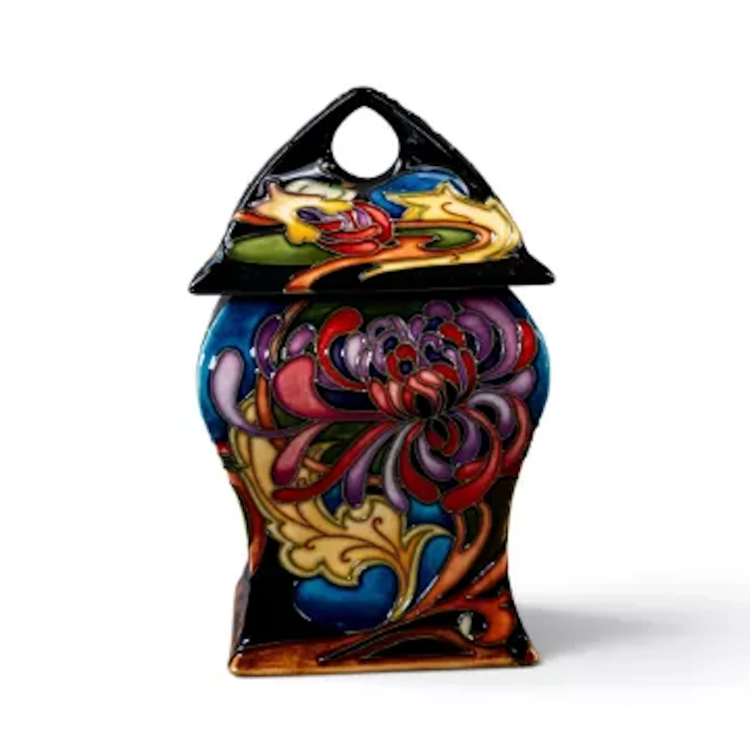 A Moorcroft limited edition lidded jar in the Flower Box design by