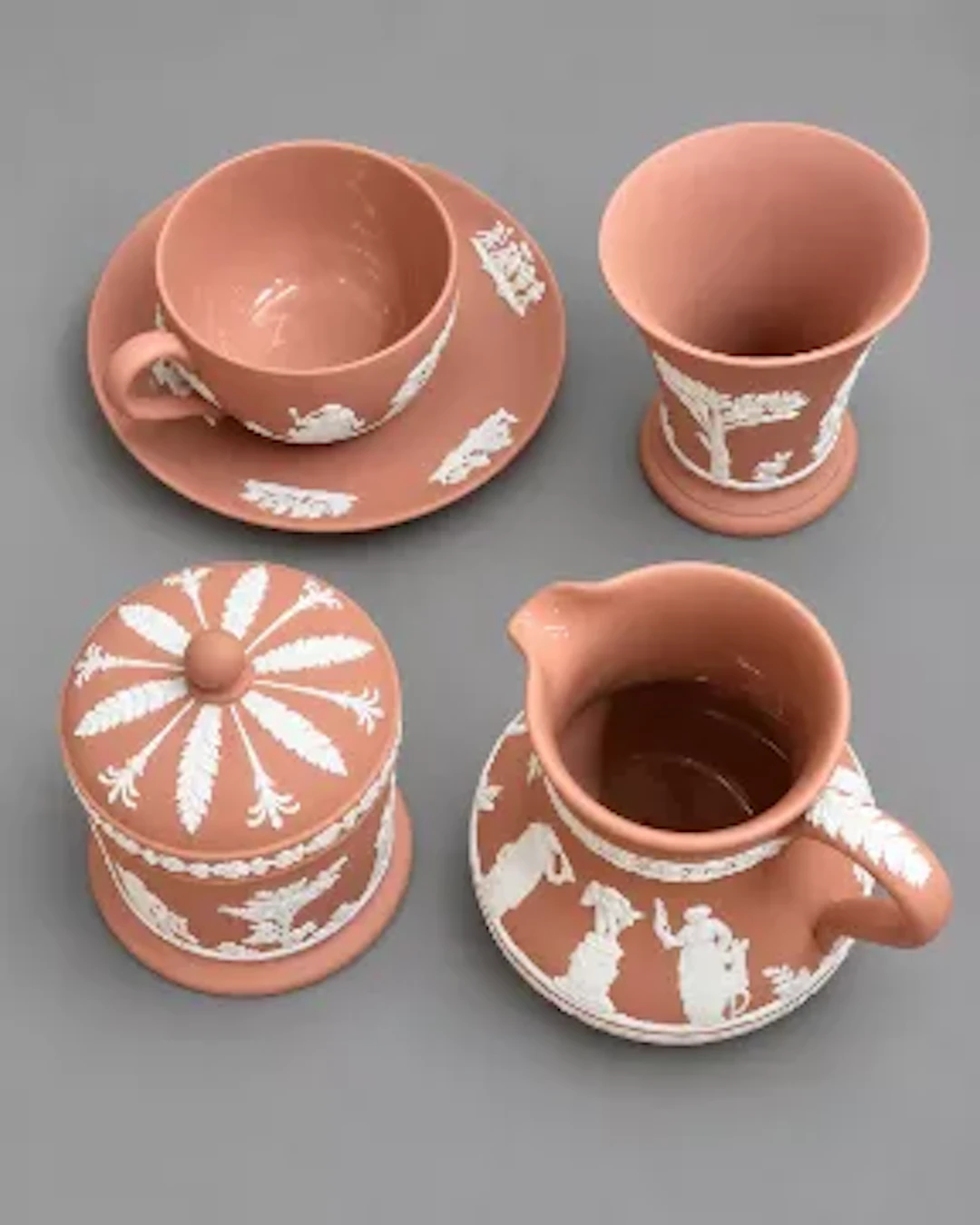 Wedgwood jasperware tea cup and saucer, flared vase, lidded pot and