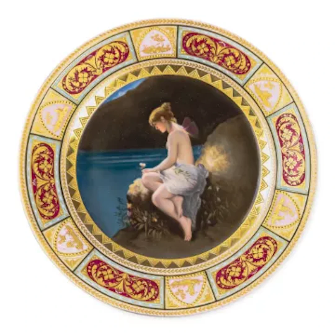 A Royal Vienna plate with a cobalt blue and gilt border, with centre