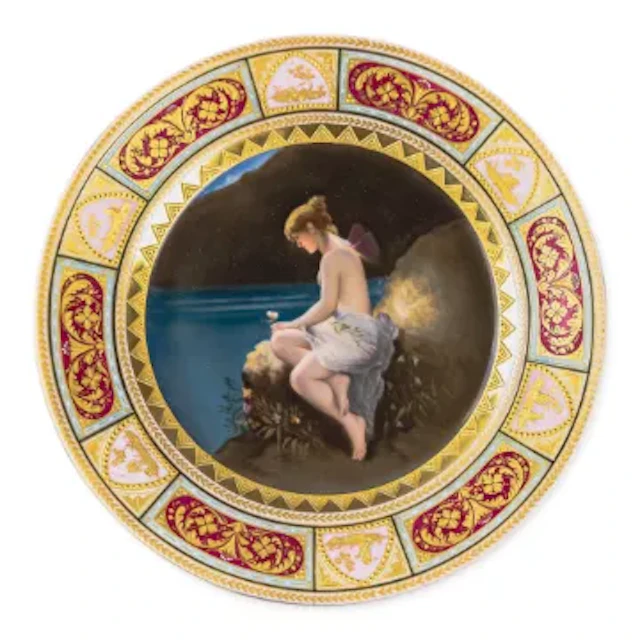 A Royal Vienna plate with a cobalt blue and gilt border, with centre