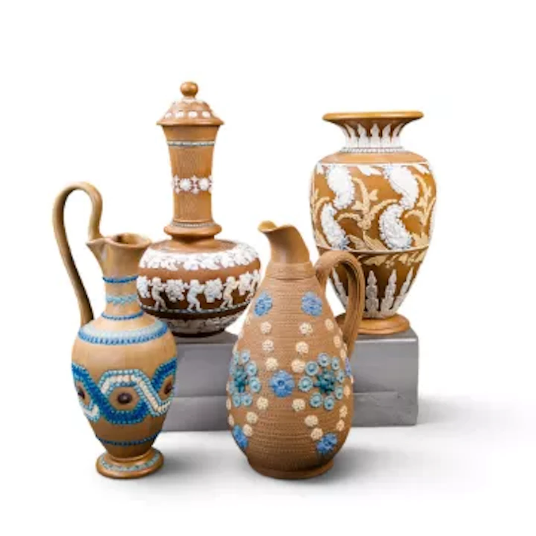 Four Doulton Lambeth Silicon ware pieces, to include a ewer with strap