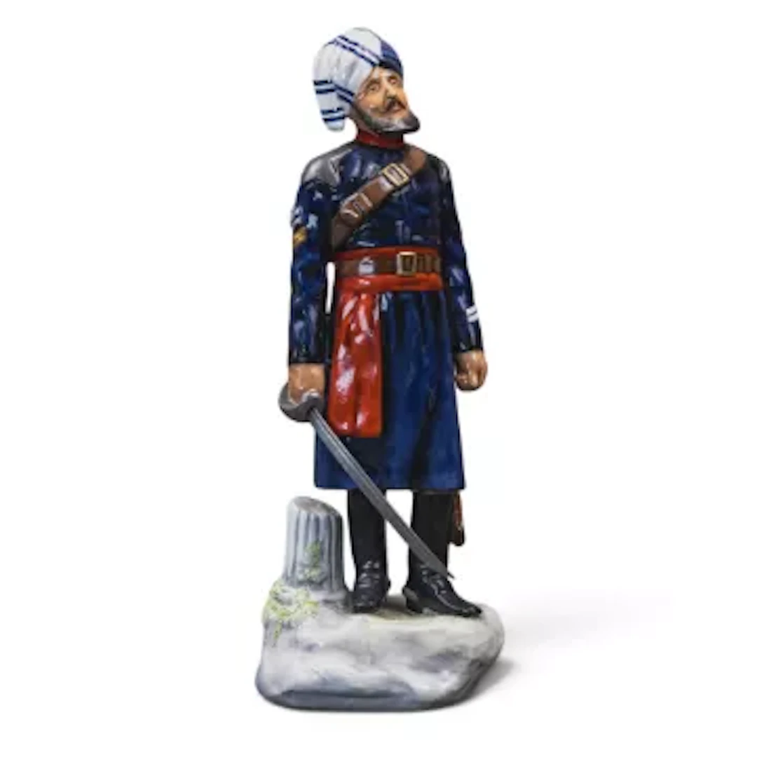 A Michael Sutty porcelain military figure, Probyn's Horse Niak, h.27cm.