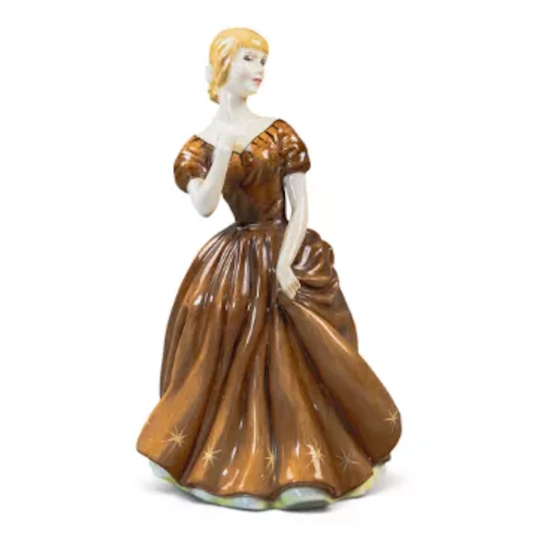 A rare Royal Doulton prototype figure of a lady in brown dress, short