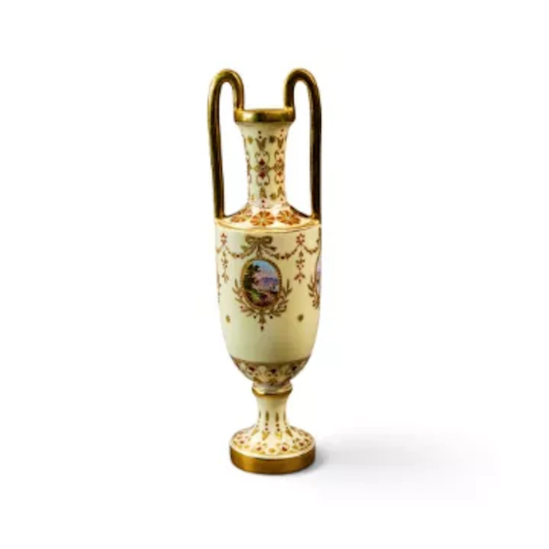 A 19th Century Coalport loop handled urn shape vase on a pedestal
