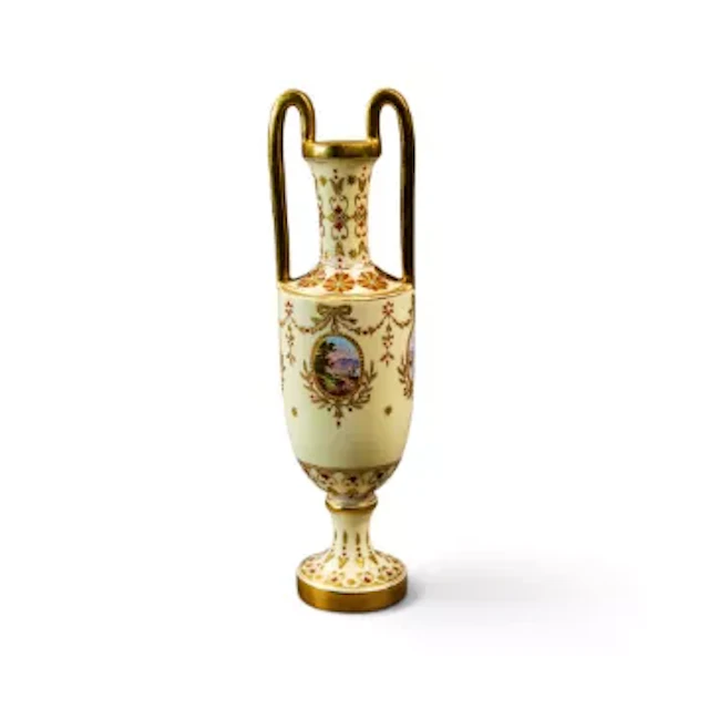 A 19th Century Coalport loop handled urn shape vase on a pedestal