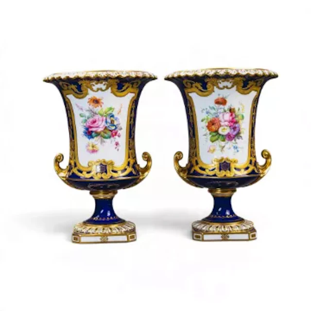 A pair of Royal Crown Derby Campana vases, decorated with a floral