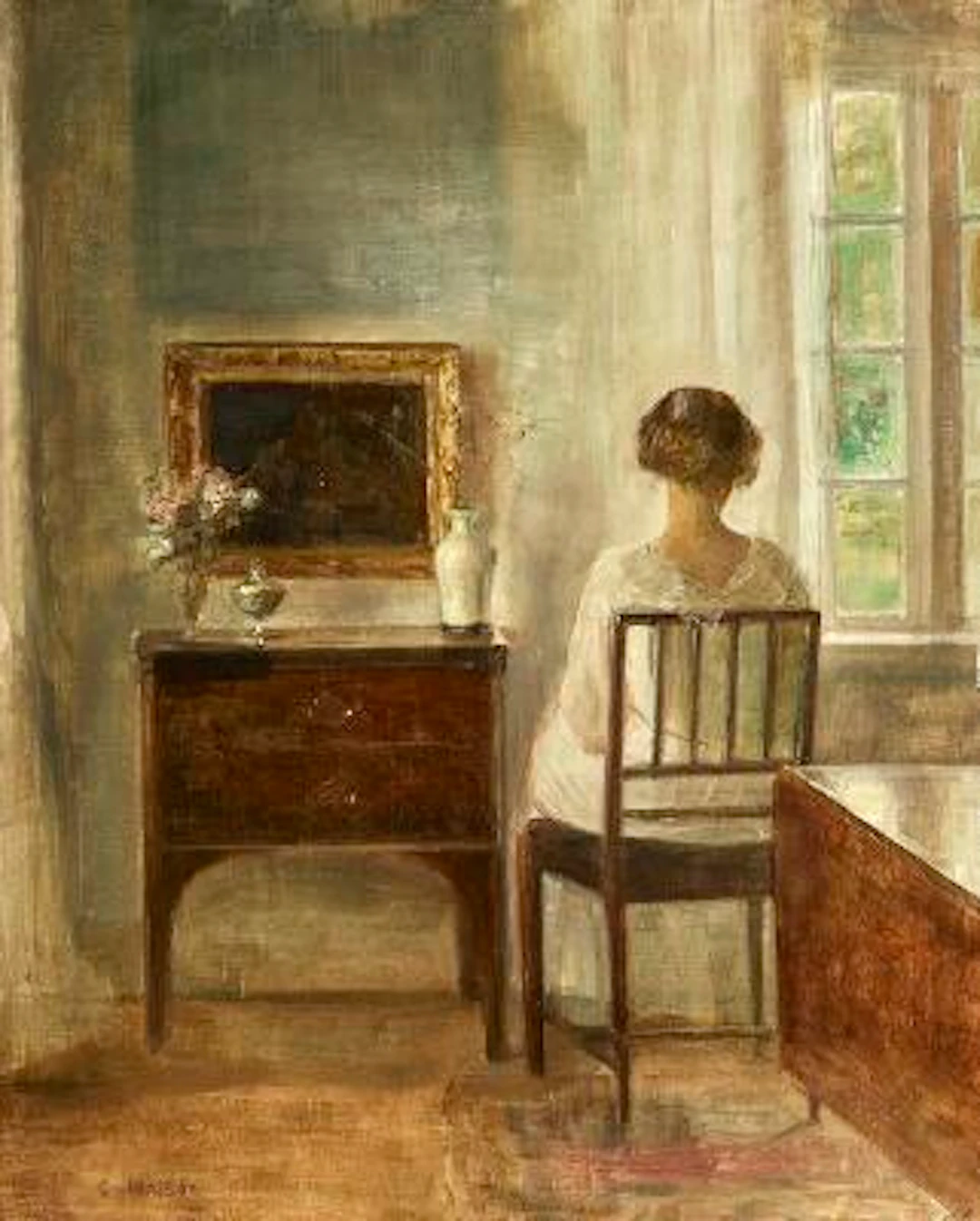 Carl Holsøe: Interior with a young woman sitting by a window. Signed