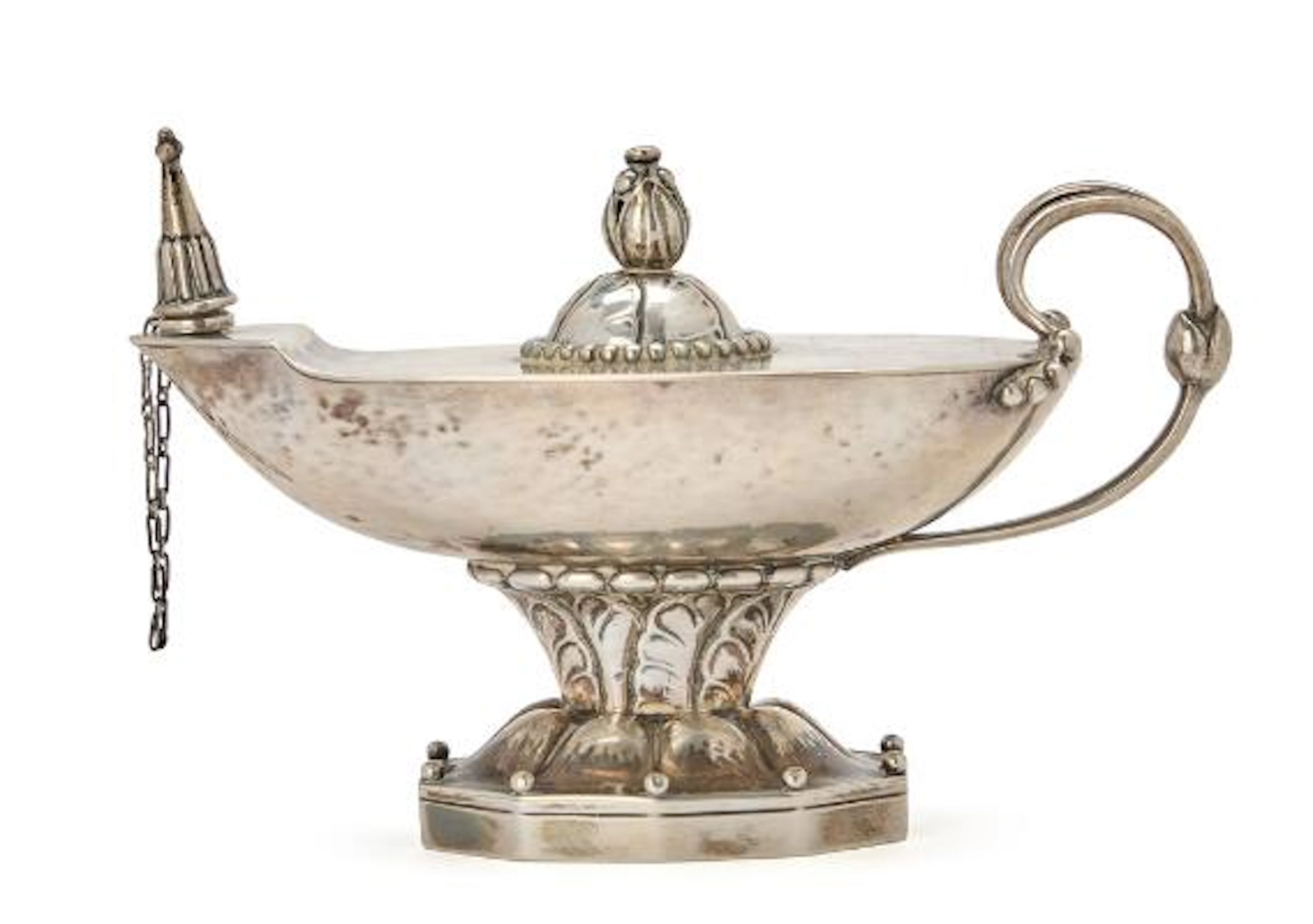 Georg Jensen: A sterling silver oil lamp with hammered surface. Edged