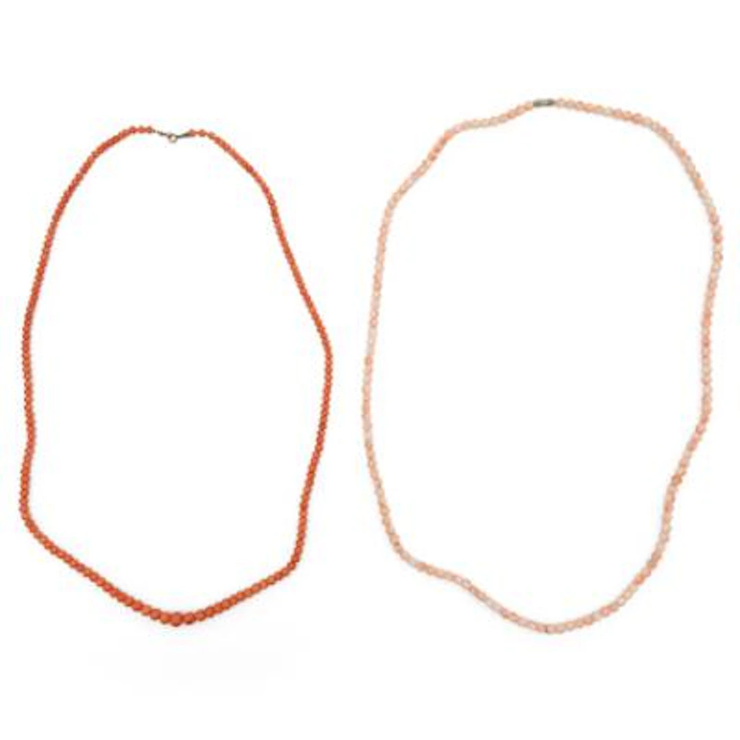 Two coral necklaces each set with numerous polished coral beads. Bead