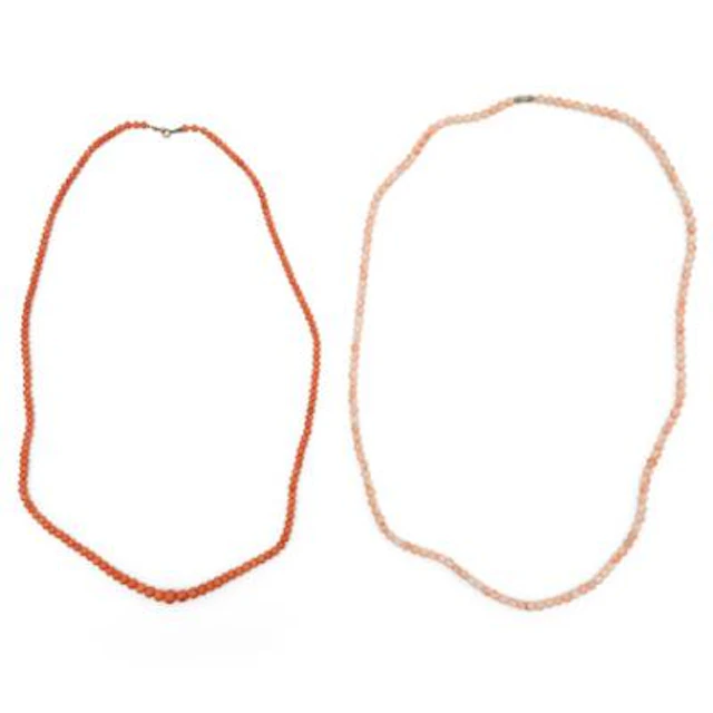 Two coral necklaces each set with numerous polished coral beads. Bead