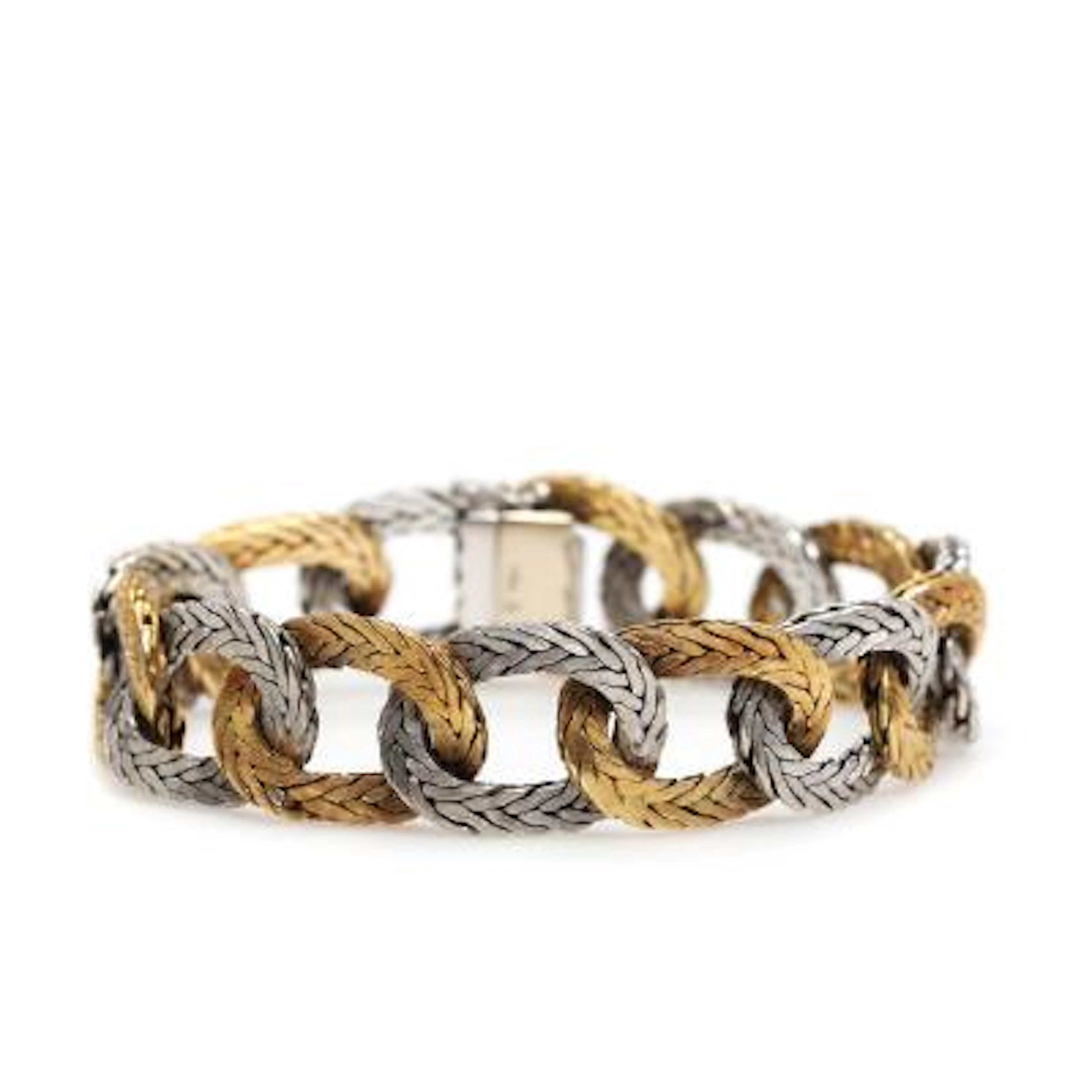 Articulated bracelet in satin-finished 18 kt. gold and white gold.