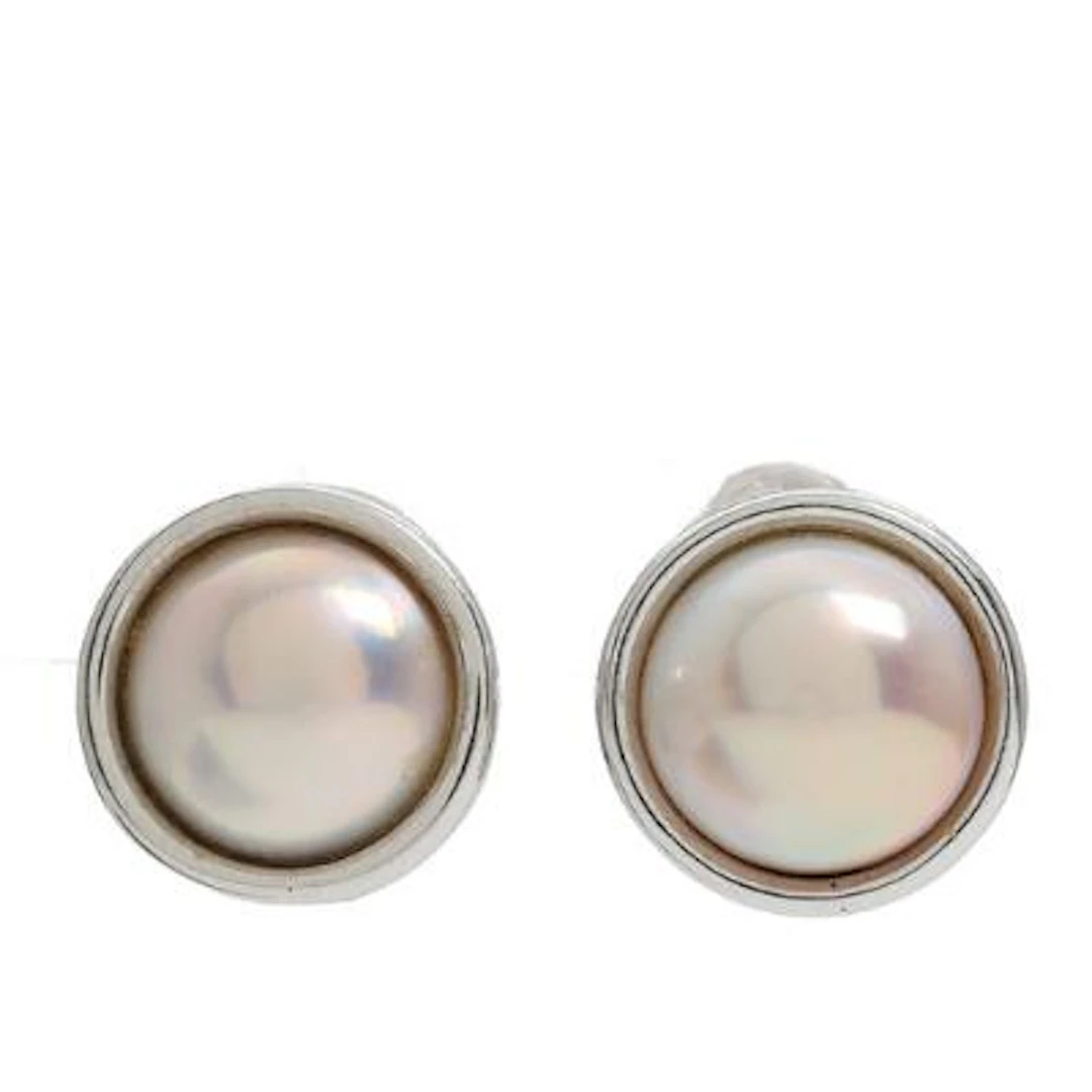 Støvring: A pair of mabé pearl ear clips, each set with a mabé pearl