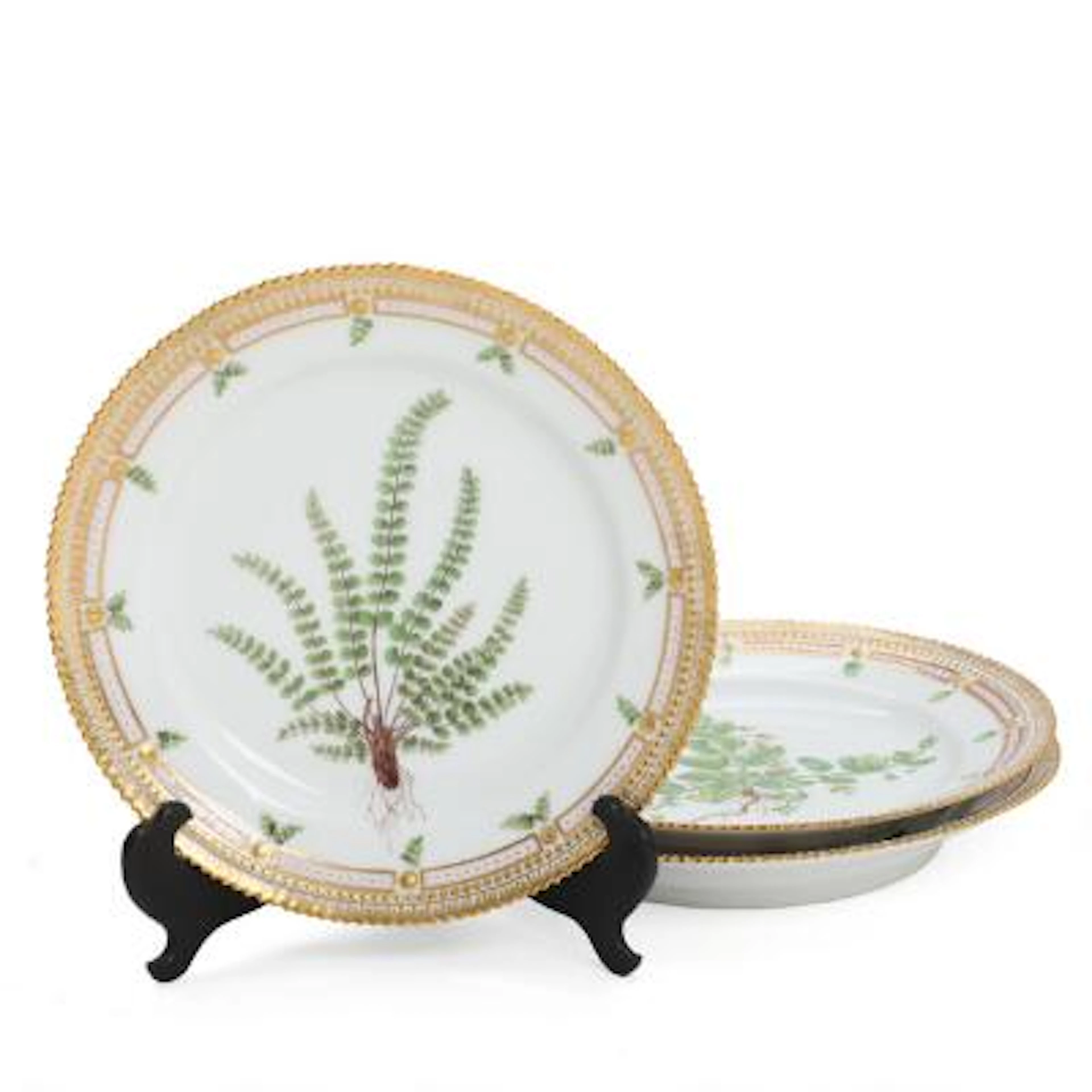 "Flora Danica". Three luncheon plates of porcelain. Royal Copenhagen.