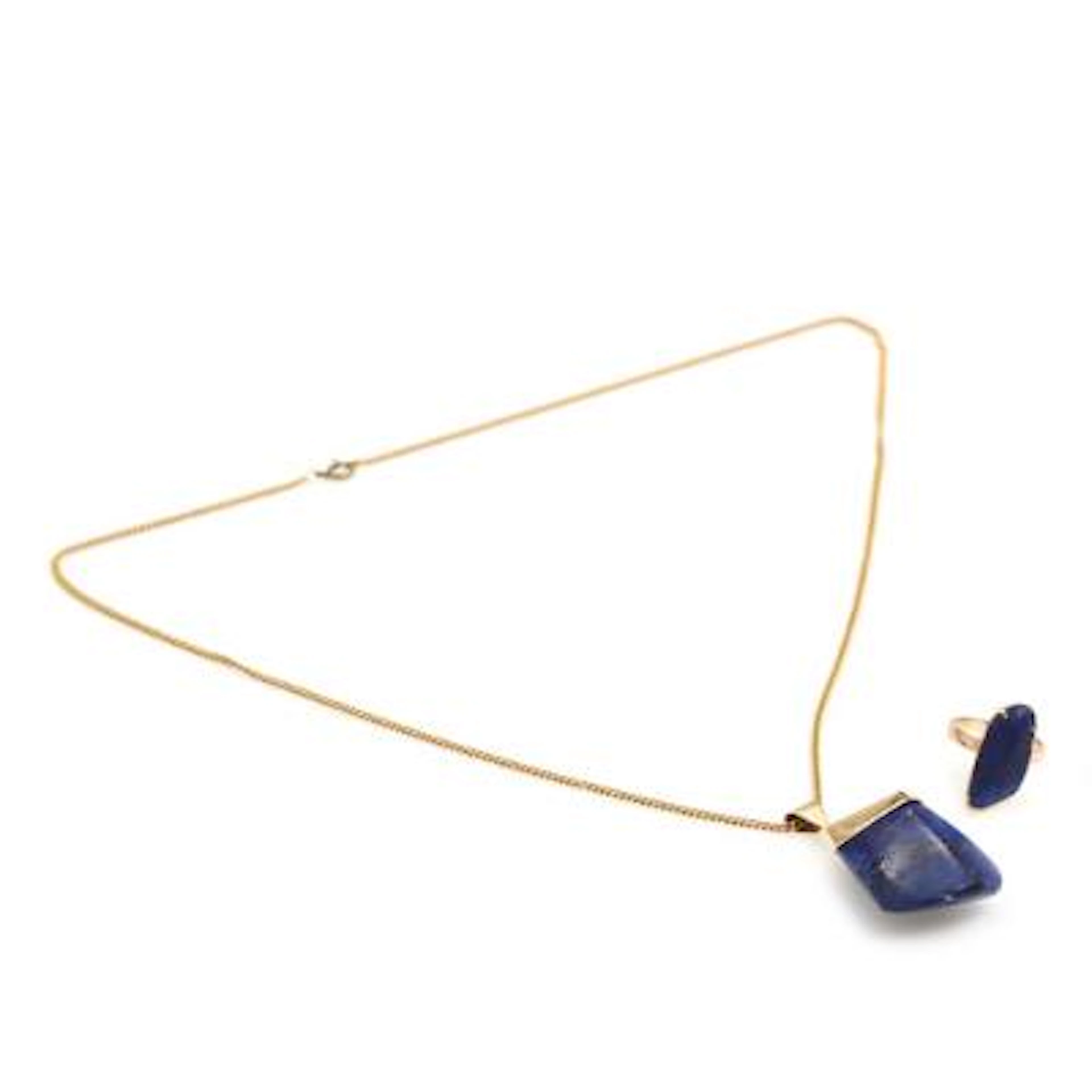 A sodalite pendant and ring each set with sodalite, respectivly mounted