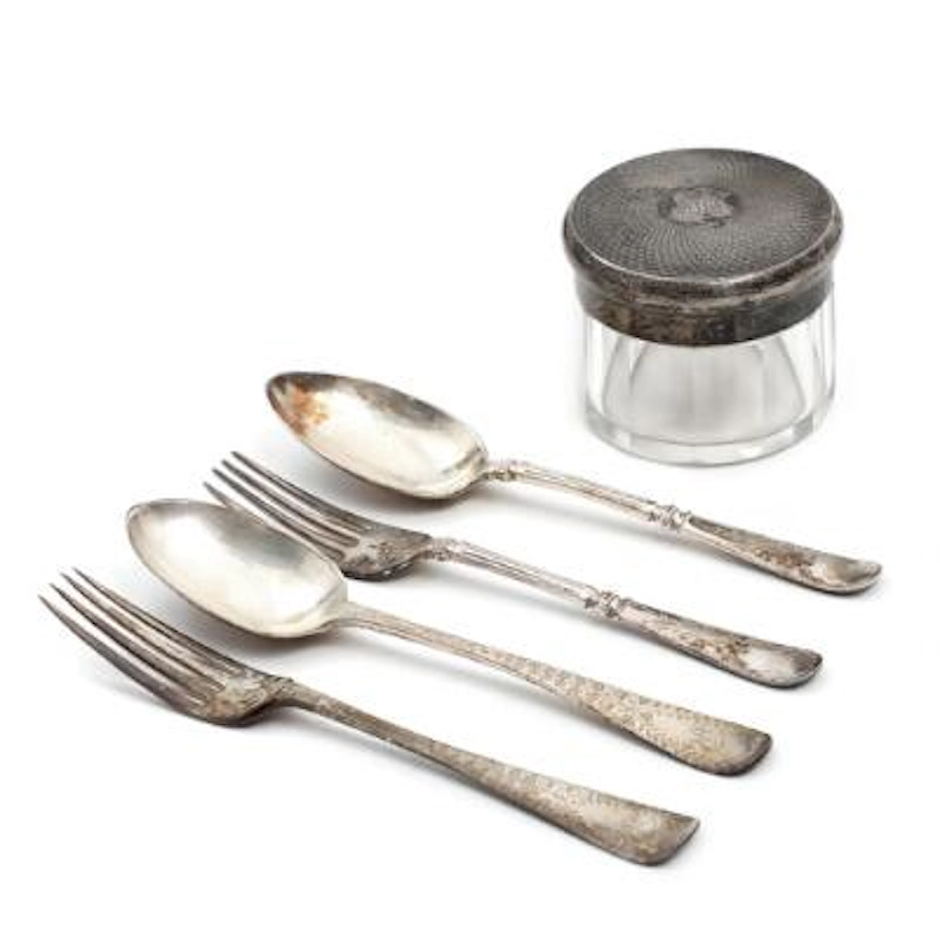 A collection of silverware comprising two sets of travelling cutlery