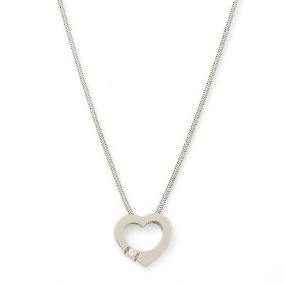 A heart-shaped diamond pendant, mounted in 14k white gold. Accompanied